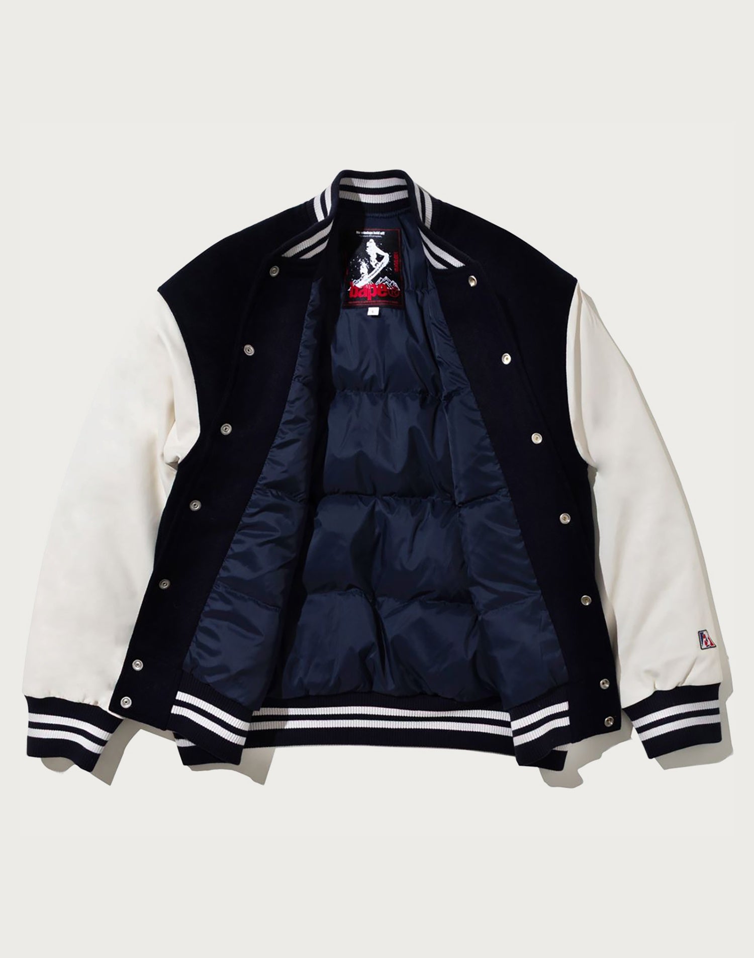 BAPE BY KAZUKI KURAISHI MULTI LOGO VARSITY DOWN JACKET MENS