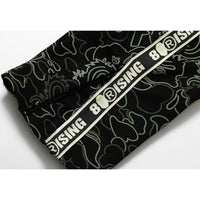BAPE X 88RISING GLOW IN THE DARK CAMO TRACK PANTS MENS